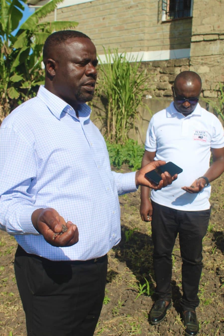 Bishop Edward Wafula praying over the land for the Faith Project